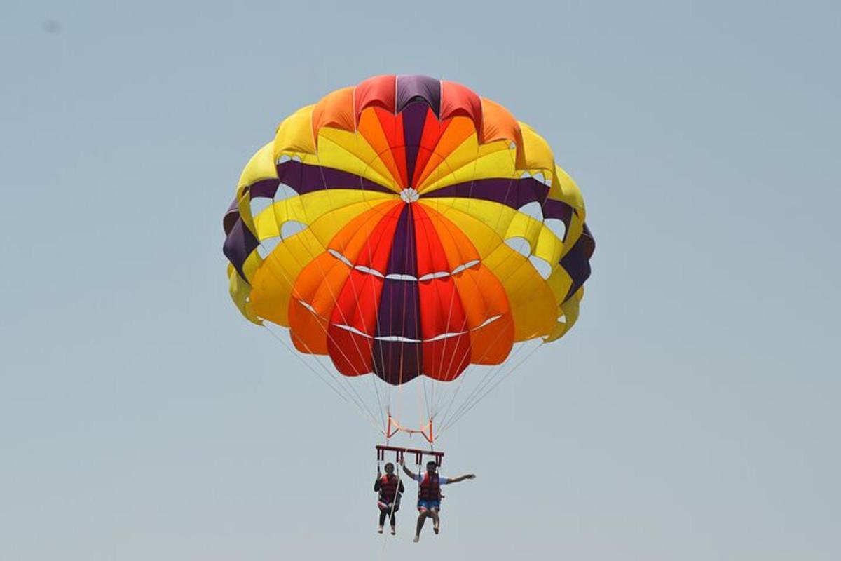 a group of people riding on a parachute