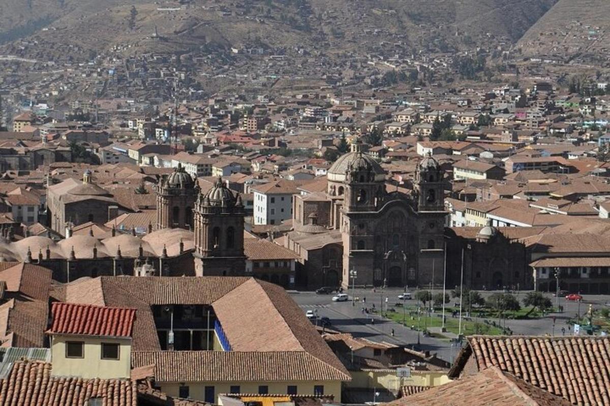 an aerial view of a city with buildings and a church