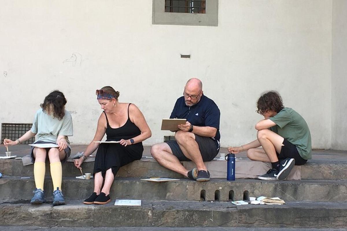 Un grupo de personas sentadas en los escalones