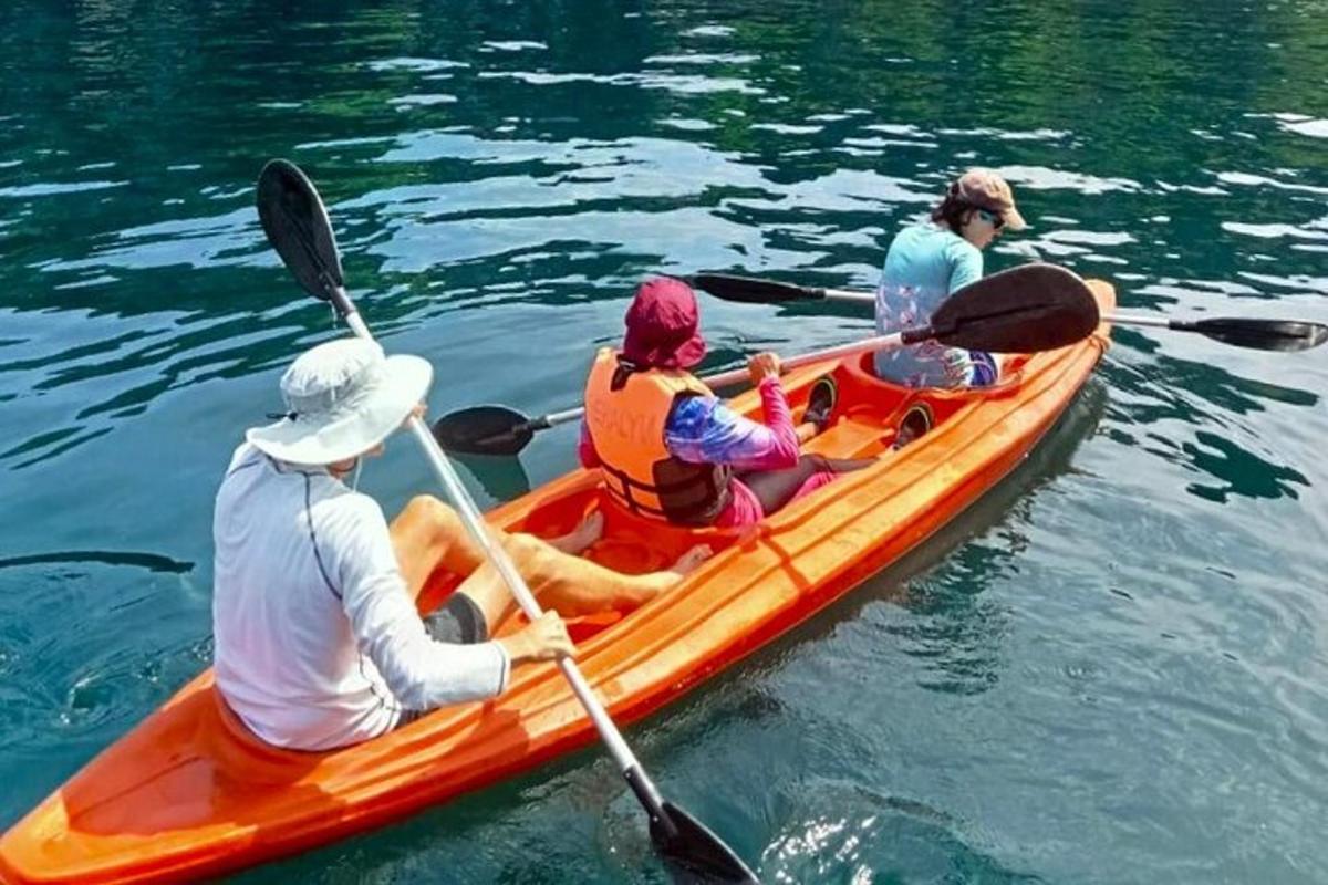 a group of people in a canoe on the water