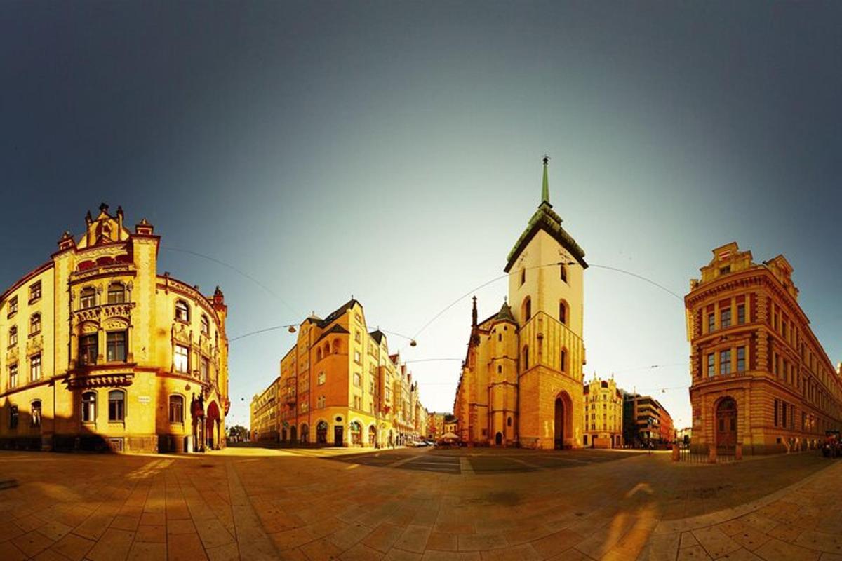a group of buildings in a city with a church