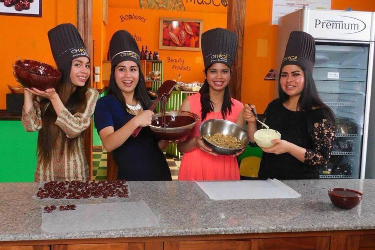 a group of women standing in a kitchen preparing food