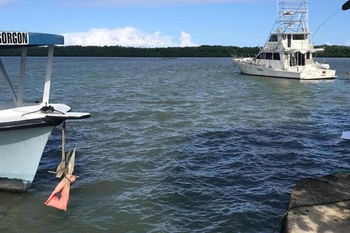 a boat is docked at a dock in the water