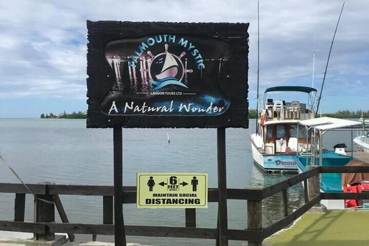 a sign in front of a marina with a boat