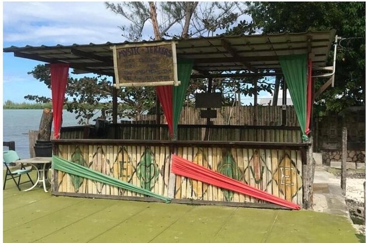 a wooden stand with a sign on a deck