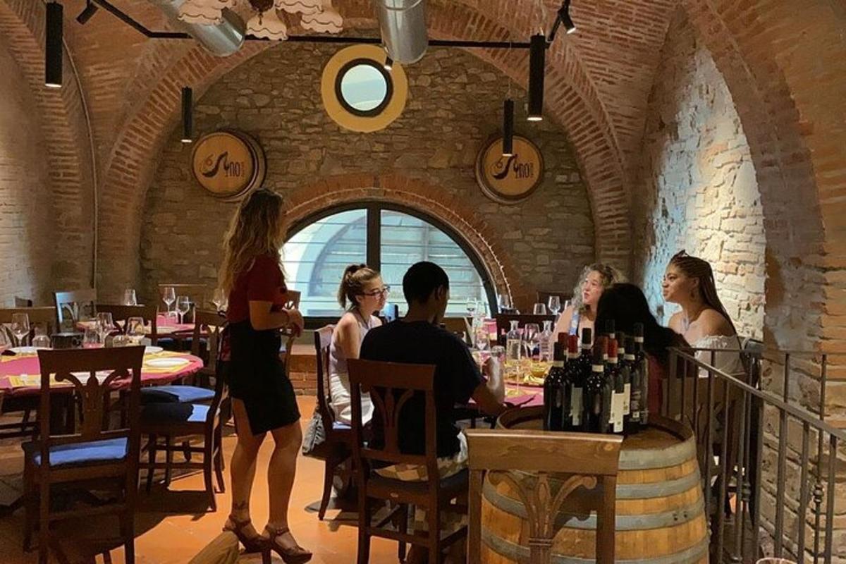 a group of people sitting at a table in a restaurant