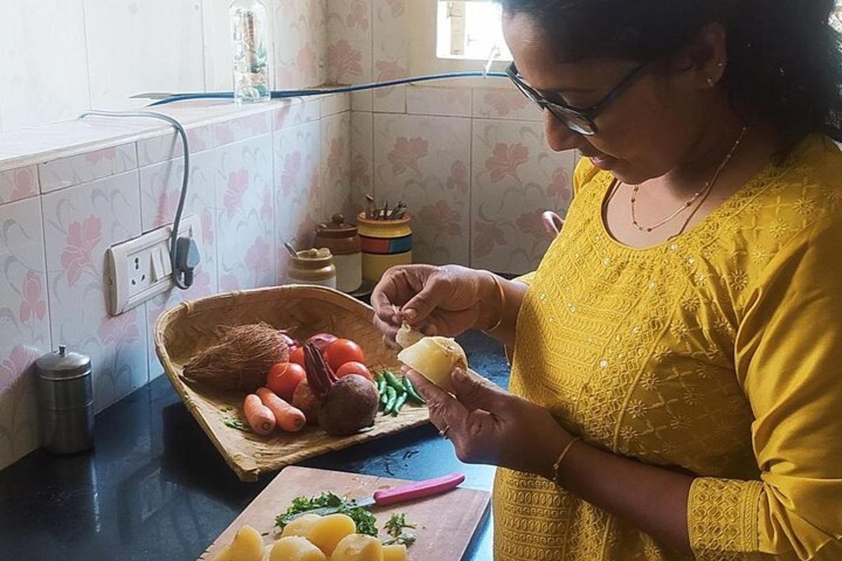 a woman standing in a kitchen preparing food