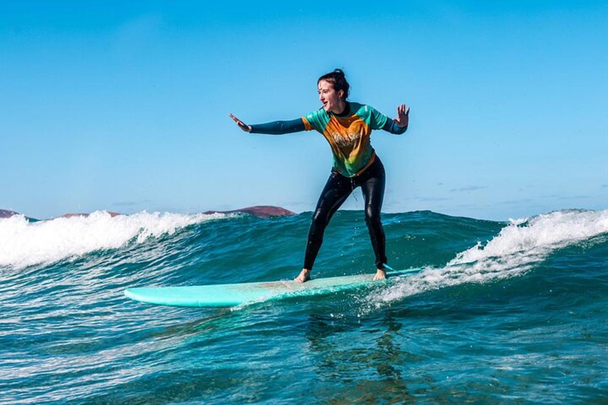 a man riding a wave on a surfboard in the ocean