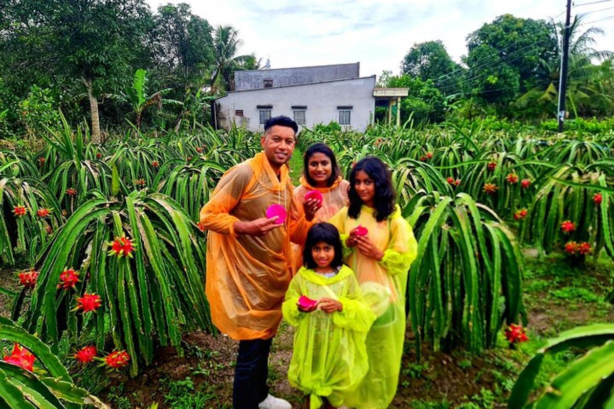 a family posing in front of a field of flowers