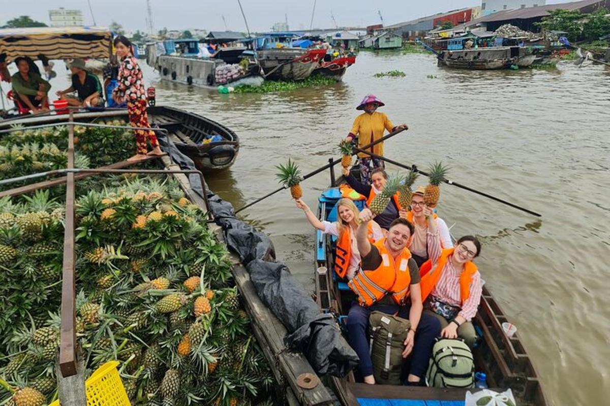 a group of people in a boat full of pineapples