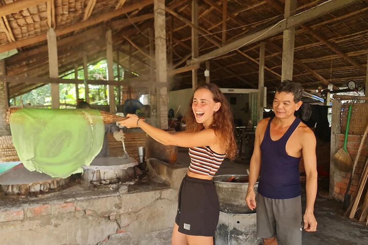 a man and a woman standing in a kitchen cooking