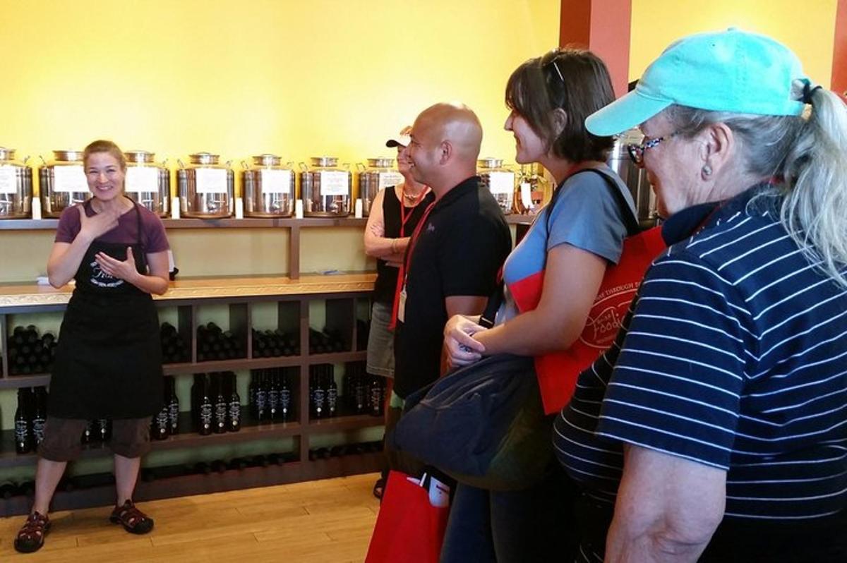 a group of people standing in a wine store