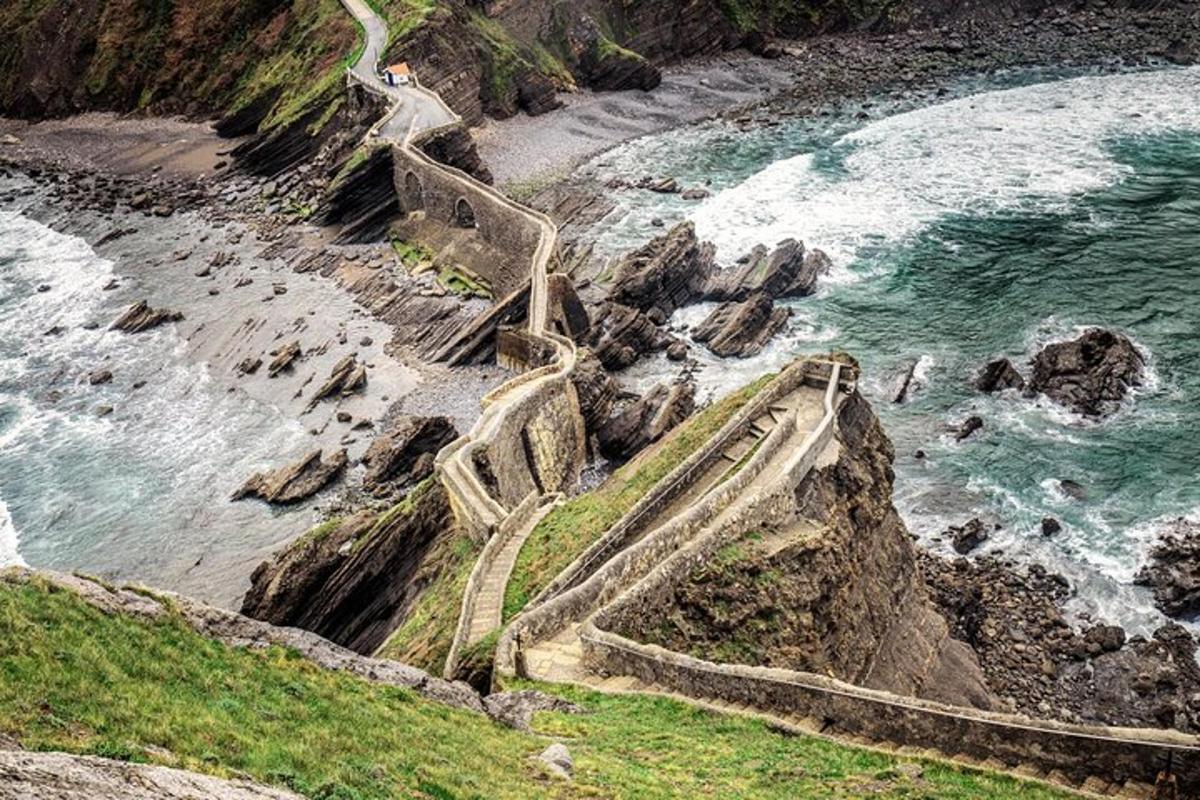 a set of stairs on the side of a rocky beach