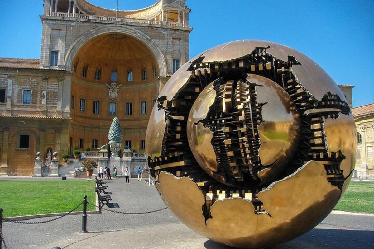 a large metal sculpture in front of a building