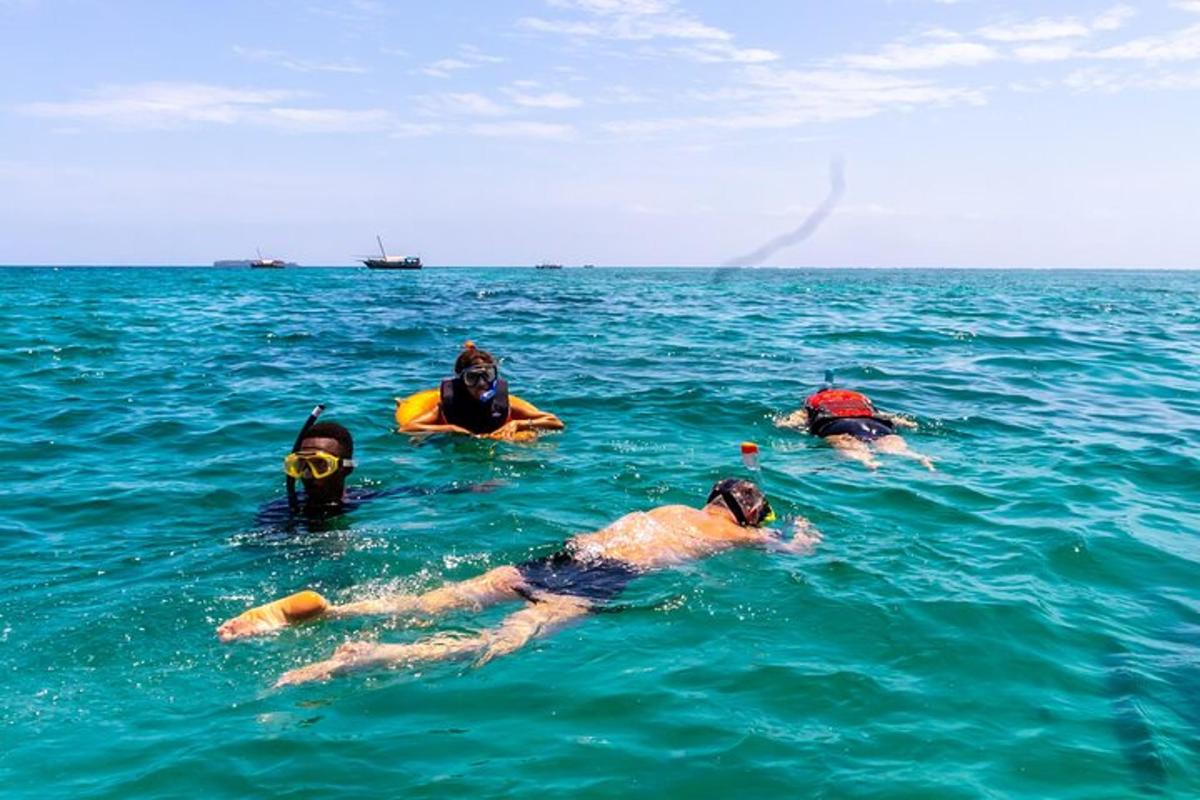 a group of people swimming in the ocean