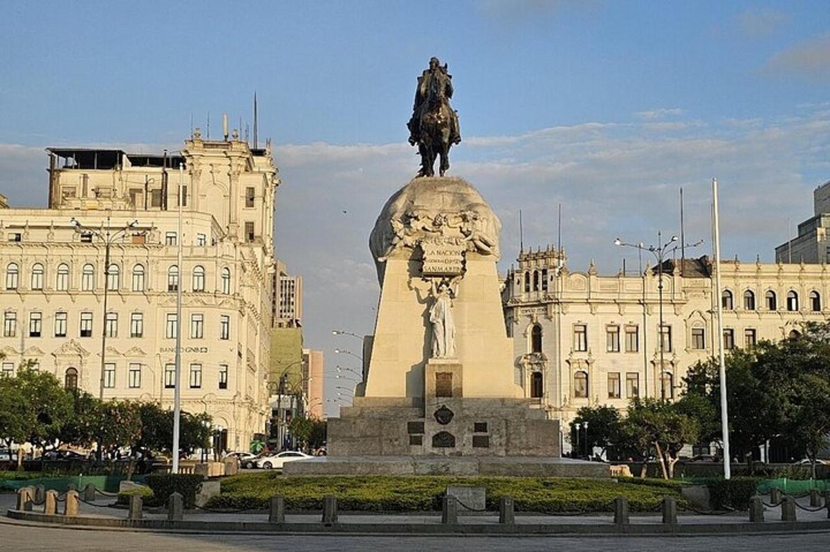 a statue of a man on a horse in front of a building