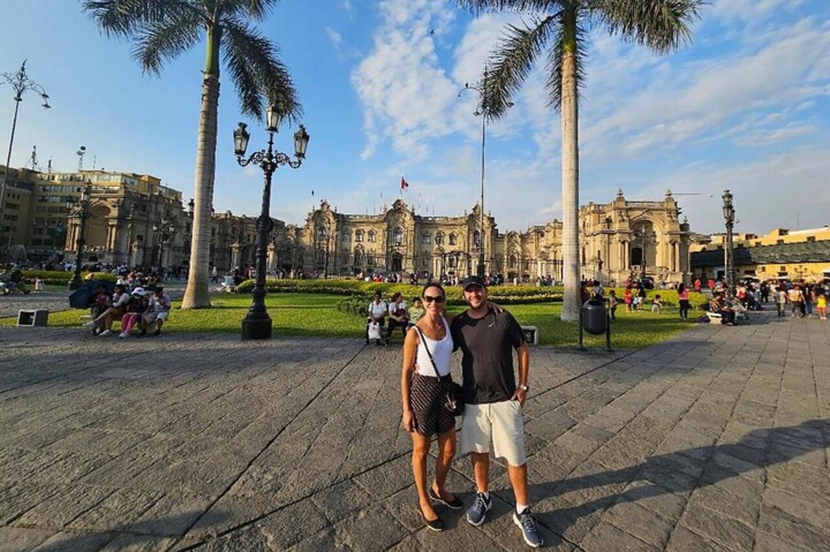 a man and a woman standing in front of a building
