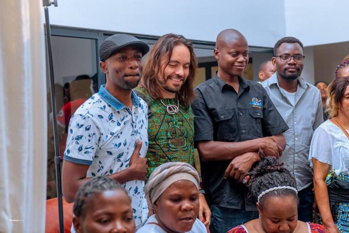 a group of people standing next to each other