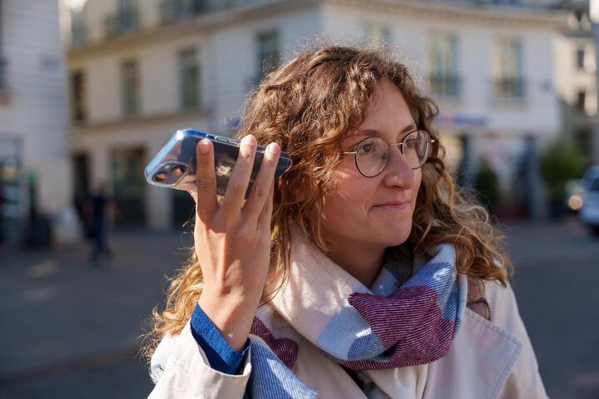 a woman taking a picture with her cell phone