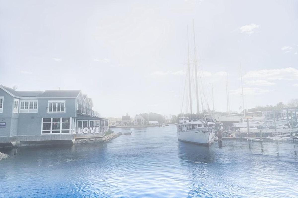 a boat is docked in a marina with a house