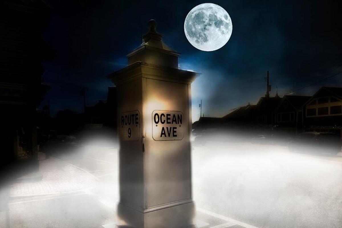 a clock tower with the moon in the background
