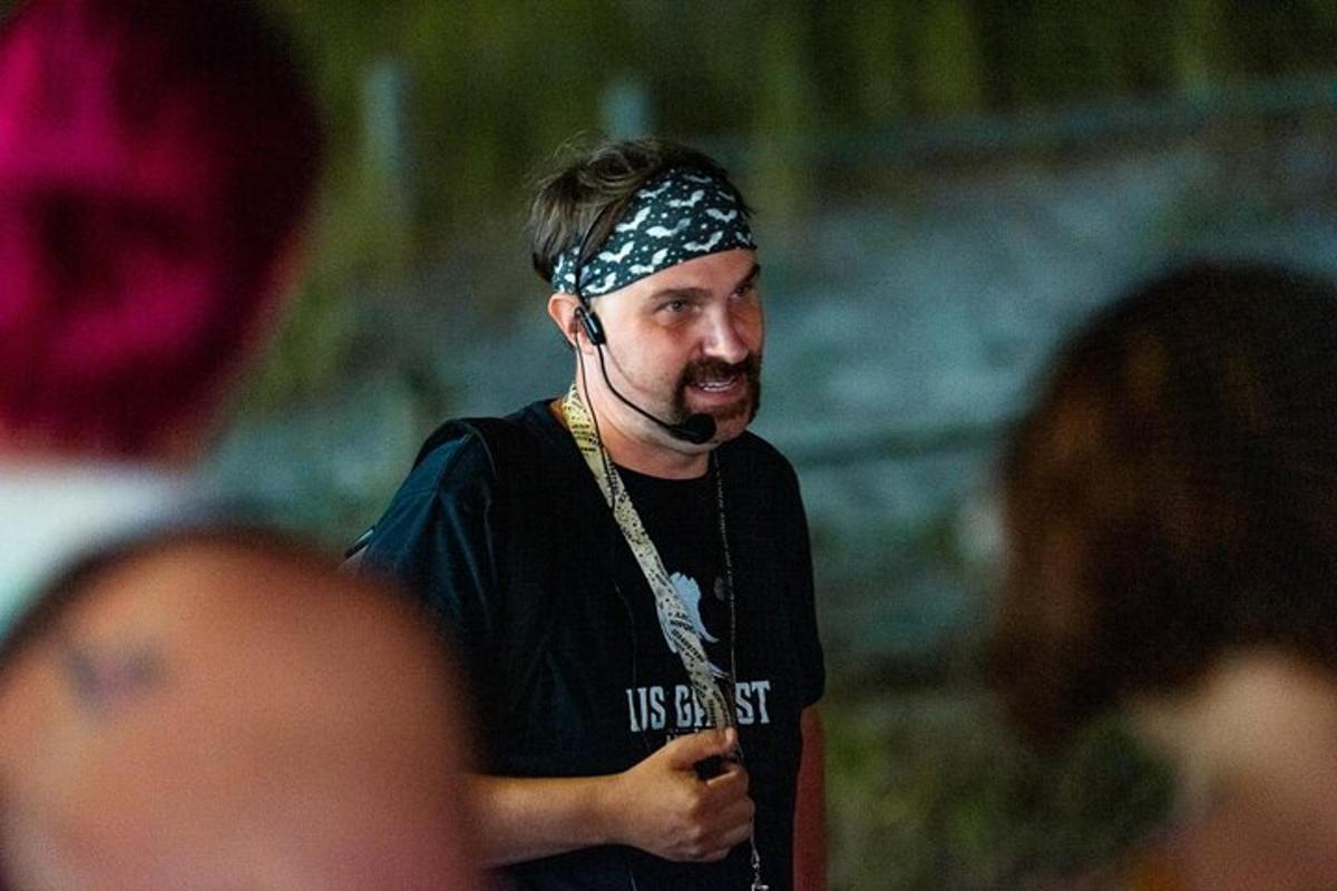 a man with a bandanna on his head with