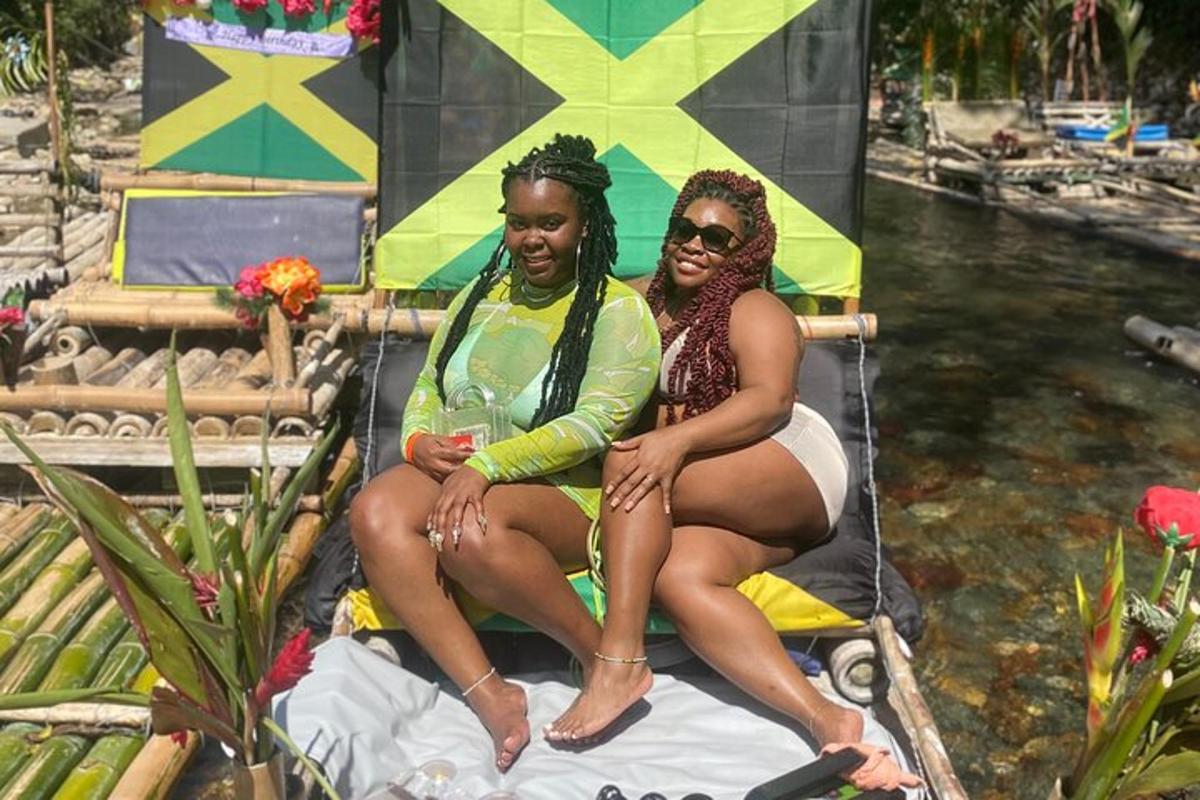 two women sitting on a boat in the water