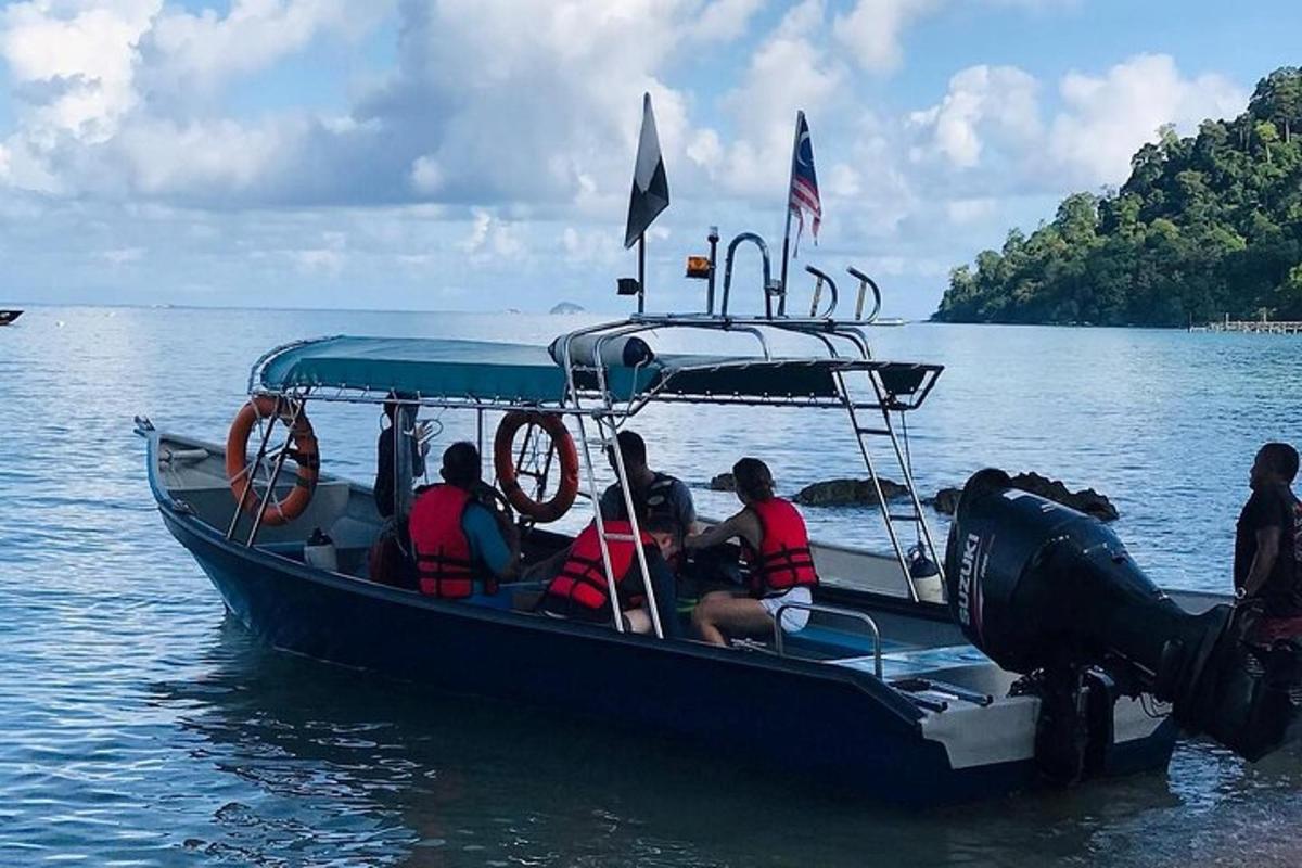 a group of people sitting on a boat in the water