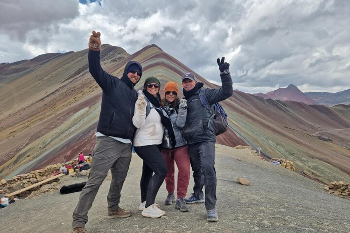 a group of people standing on top of a mountain