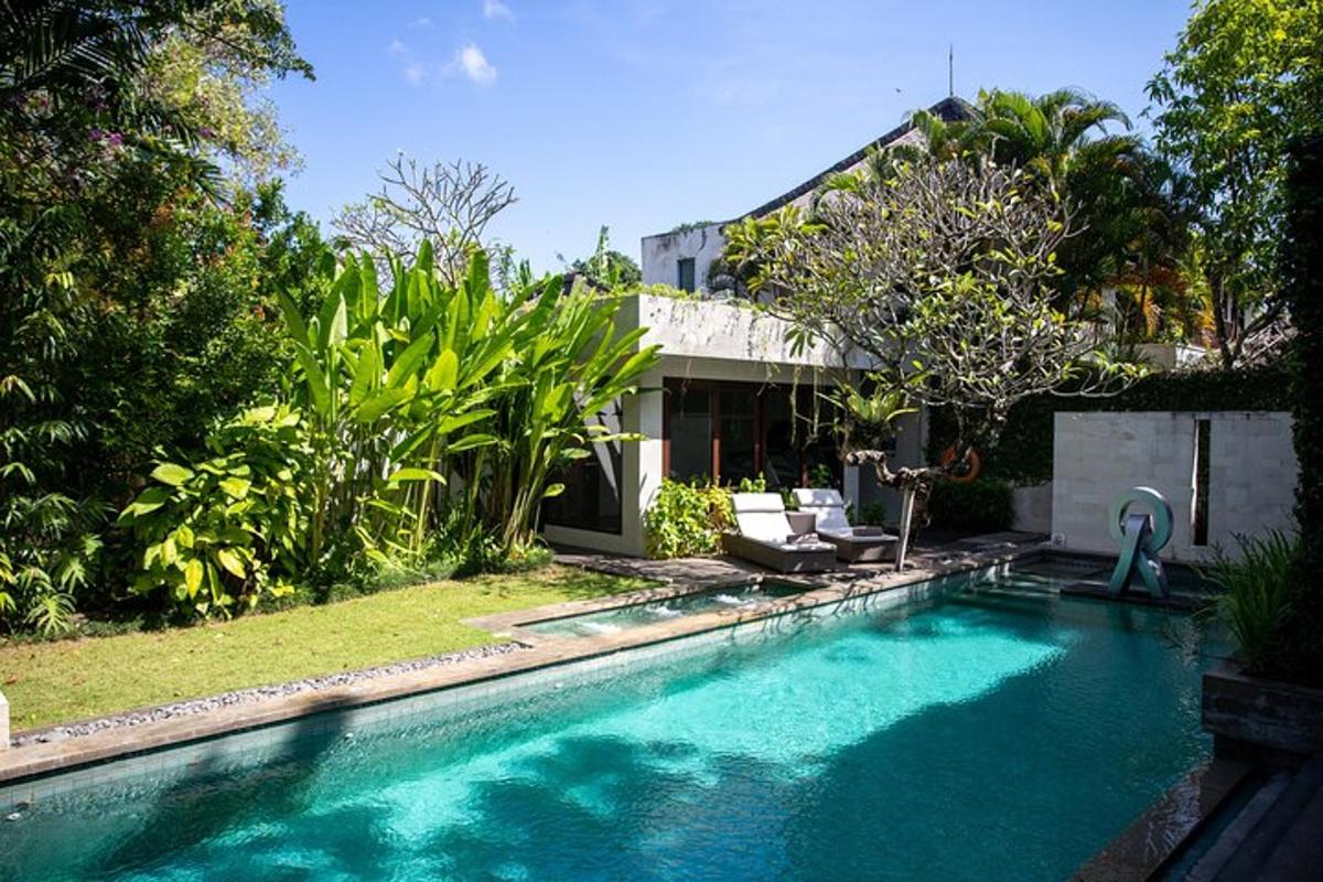a swimming pool in front of a house