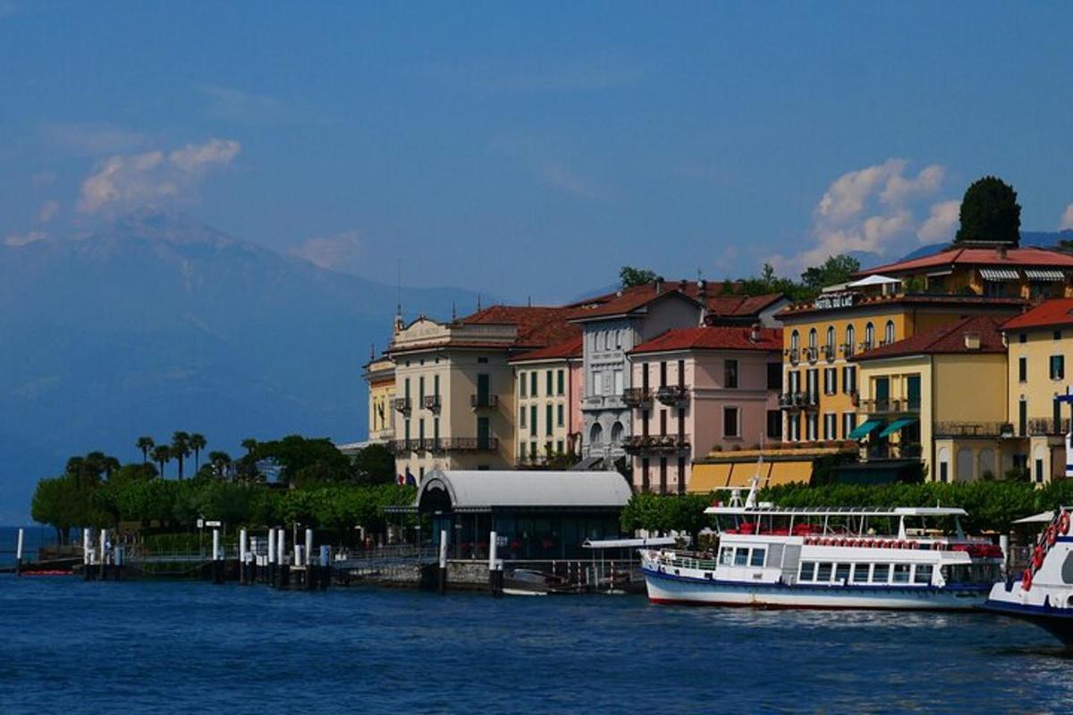 two boats are docked in the water next to buildings