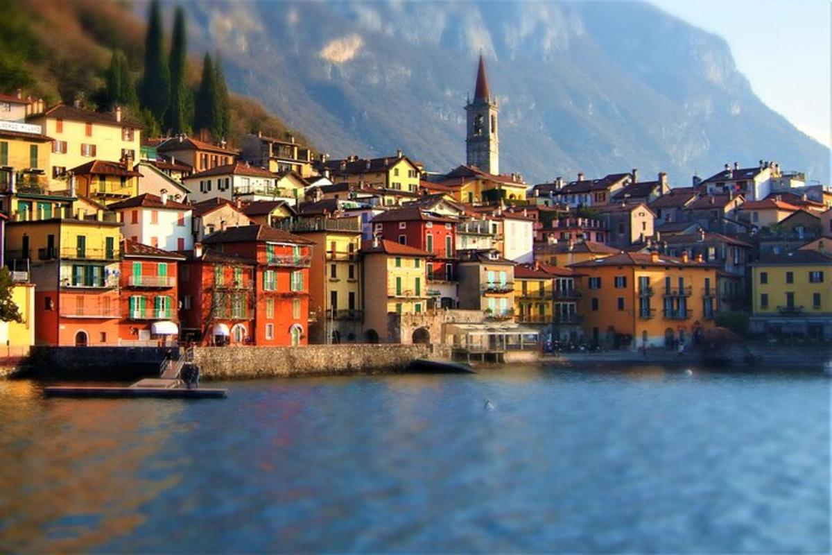 a view of a town on the water with buildings