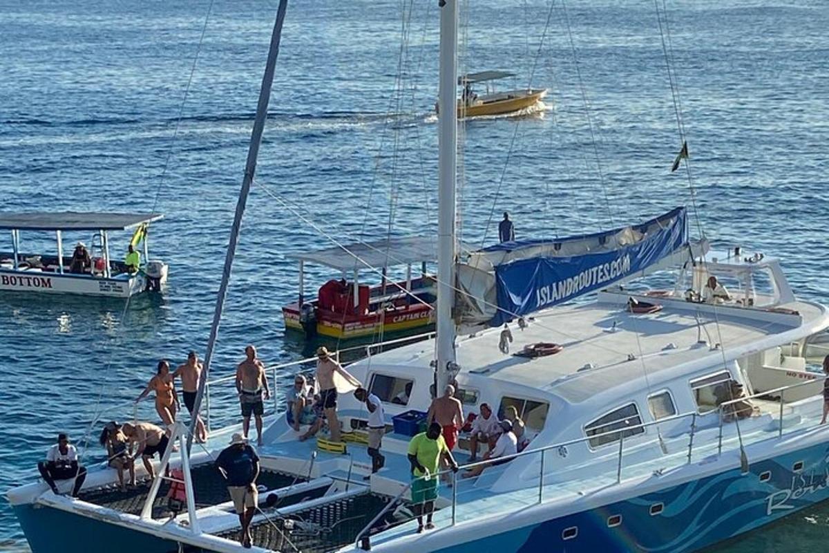 a group of people on a boat in the water