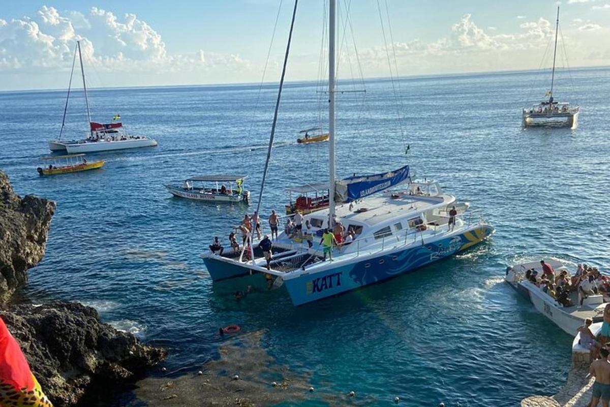 a group of boats in the water with people on them