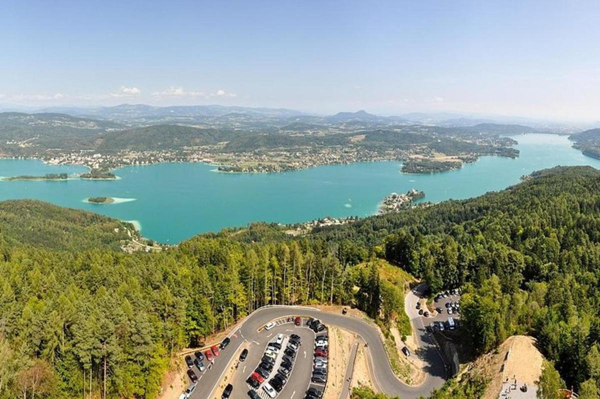 an aerial view of a bridge over a lake