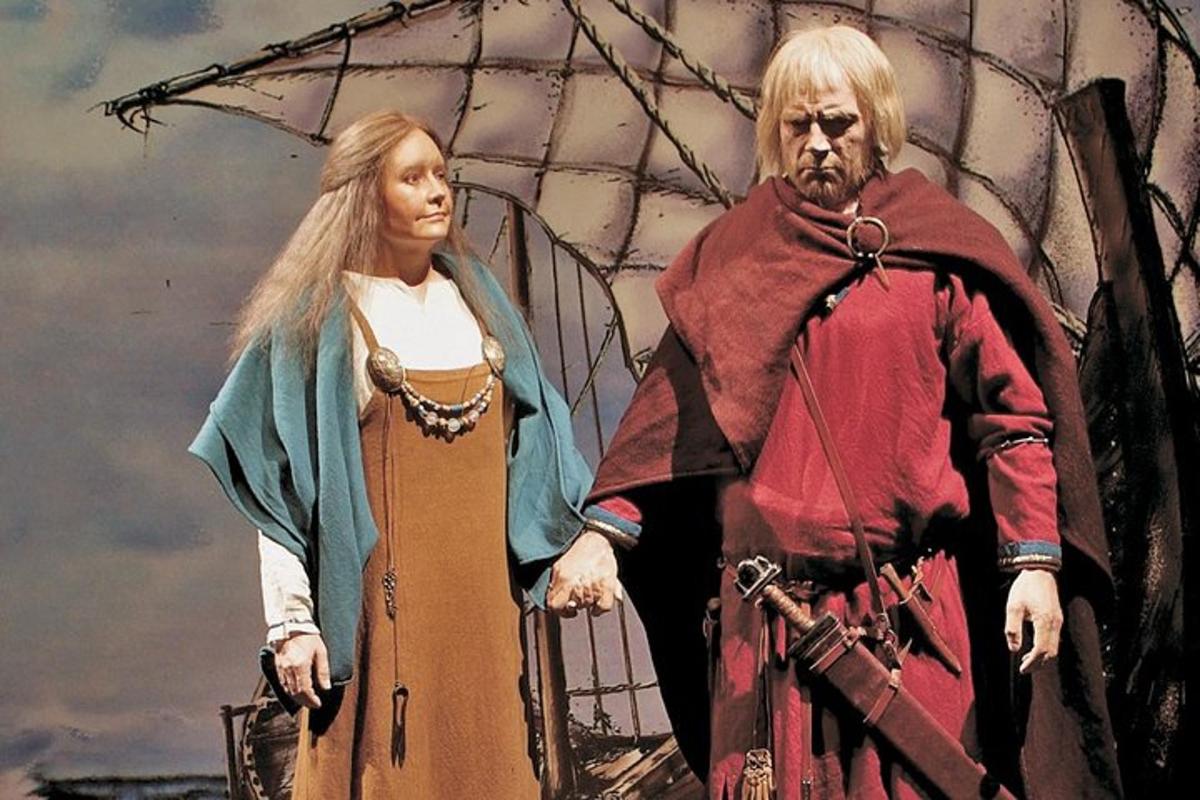 a painting of a man and a woman standing on a boat