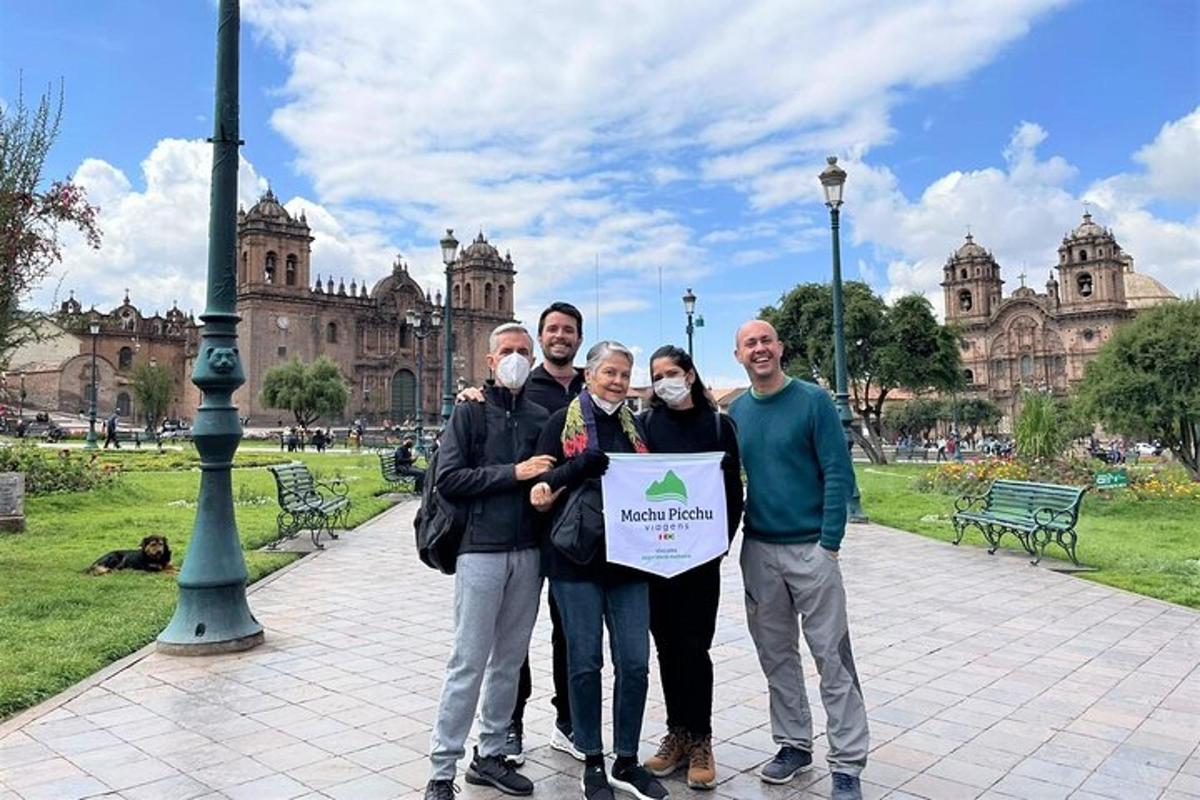 a group of people holding a sign in a park