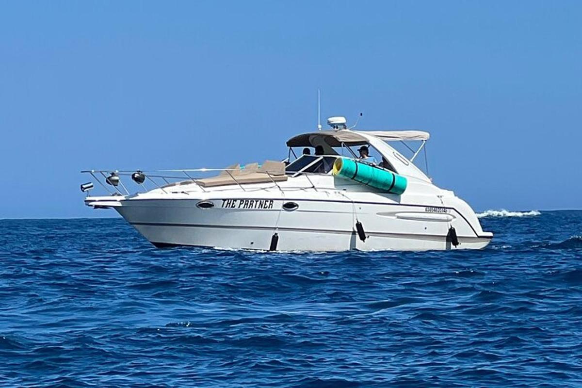 a white boat in the middle of the water
