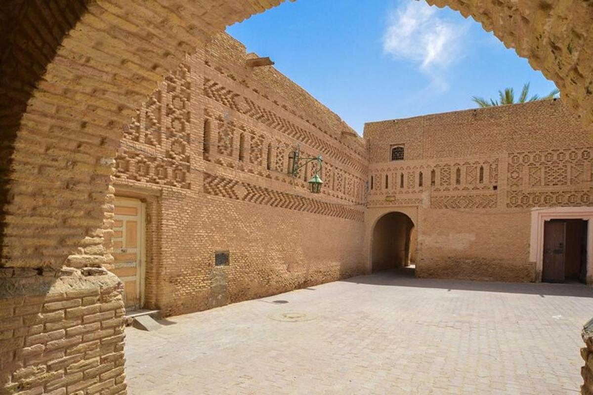 an entrance to a brick building with an archway
