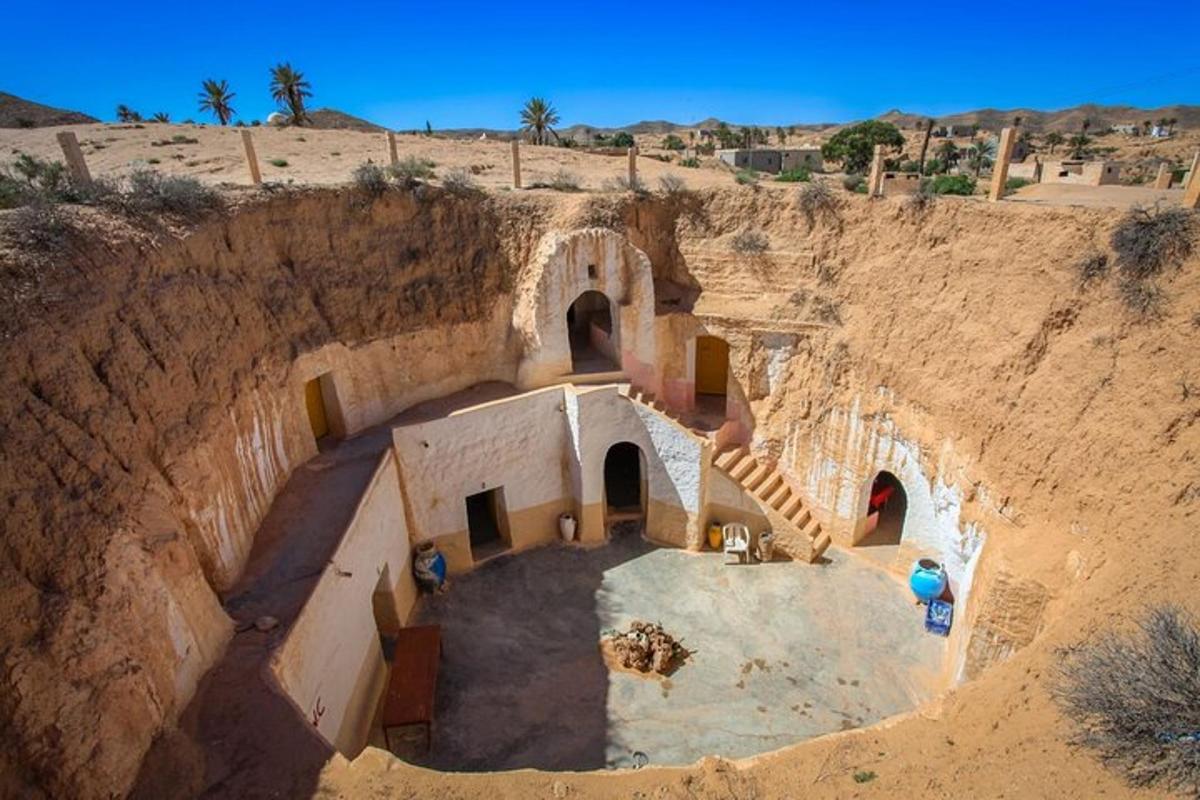 an aerial view of a building on a cliff