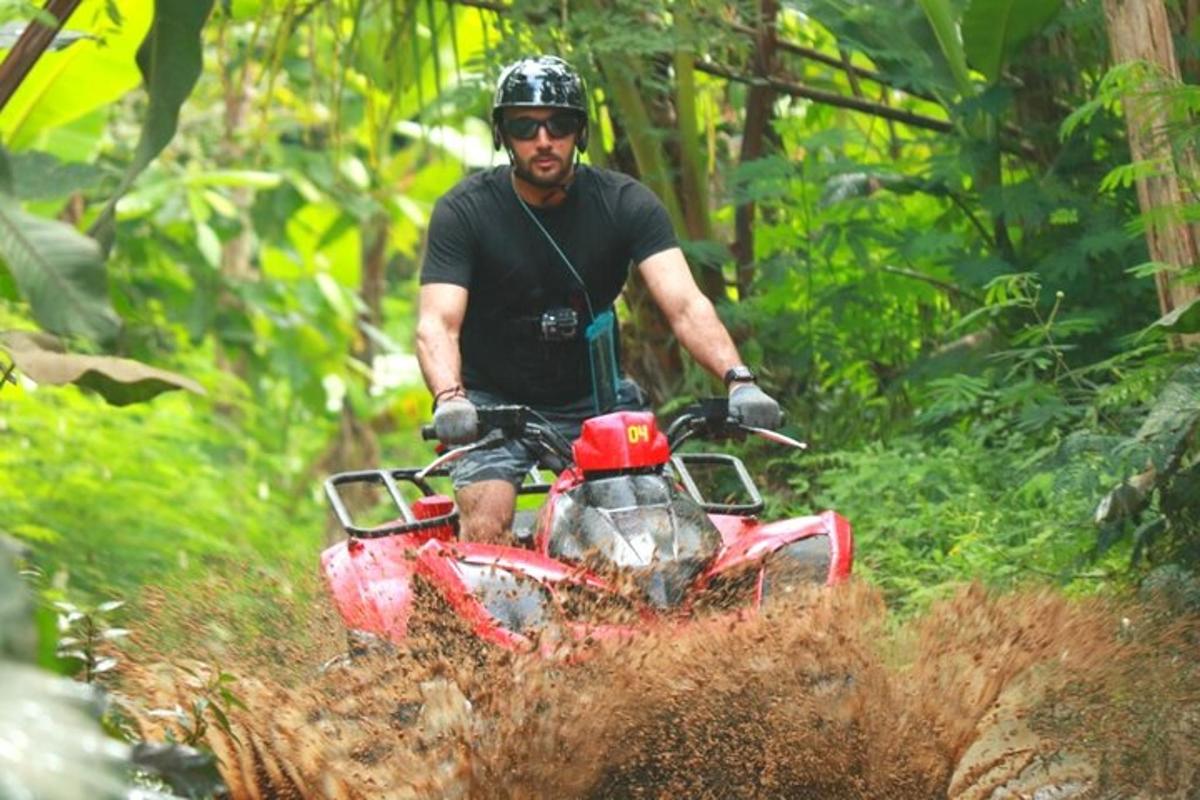 a man riding a dirt bike in the woods
