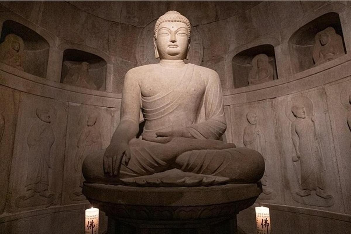 a statue sitting in a room in a building