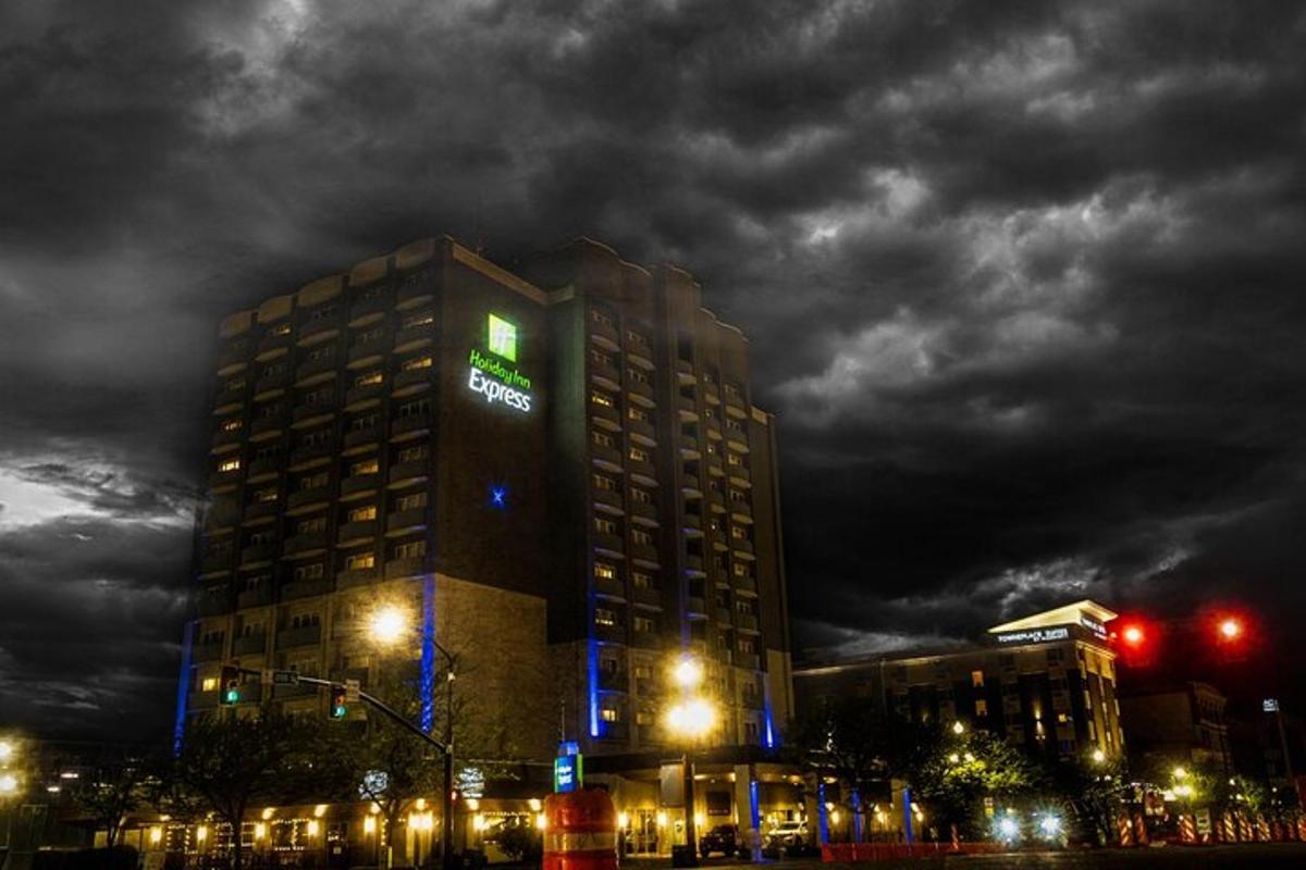a building with a green sign on top of it