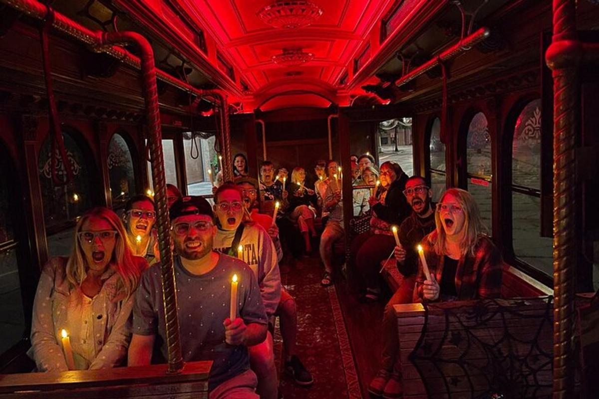 a group of people on a bus holding candles