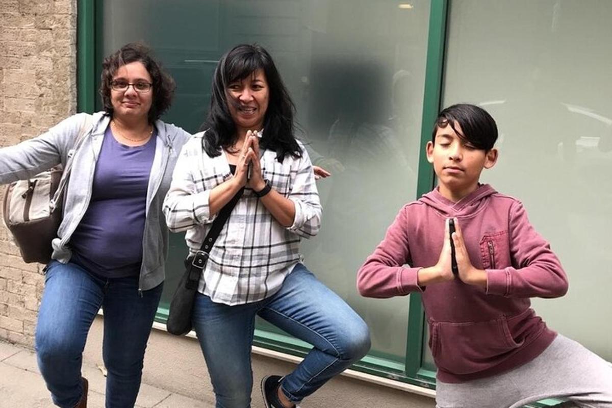 two women and a child doing a gesture with their hands