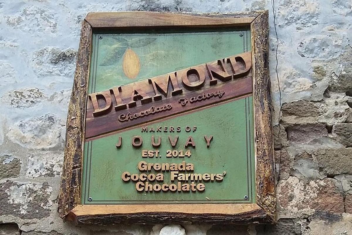 a sign for a restaurant on a brick wall