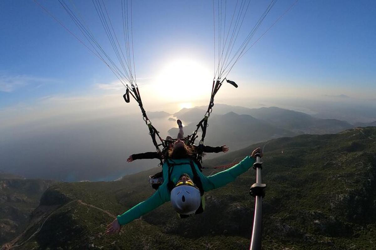 a person is suspended in the air in a parachute