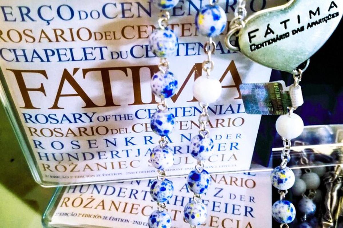 a group of signs with beads and a book