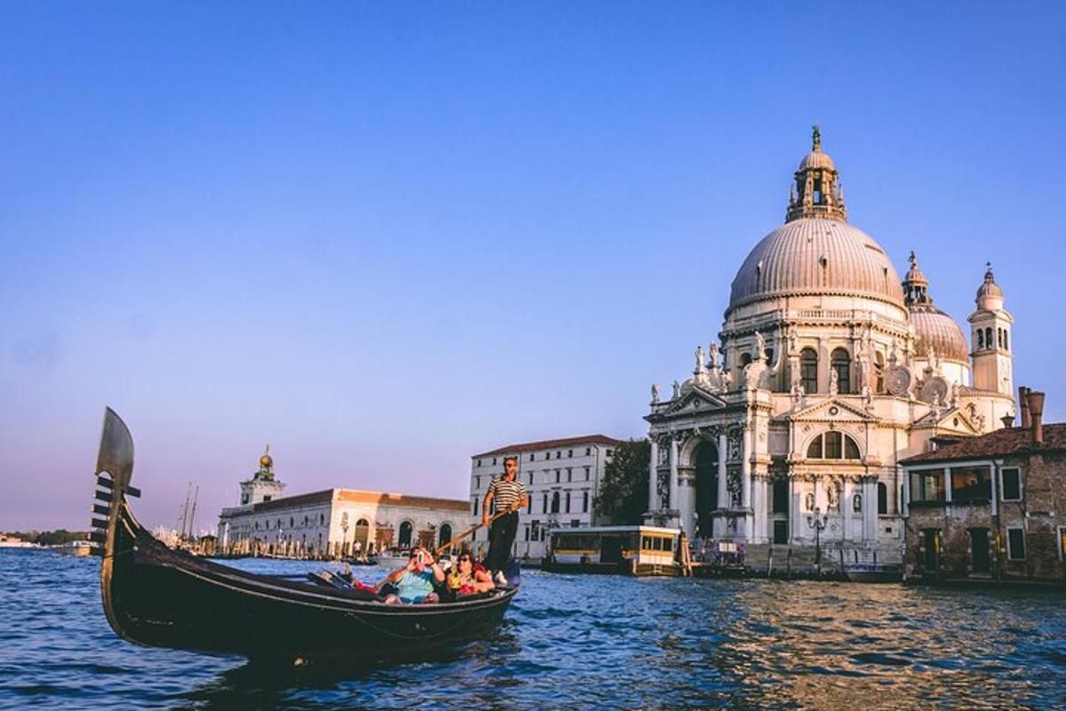 a gondola in the water in front of a building