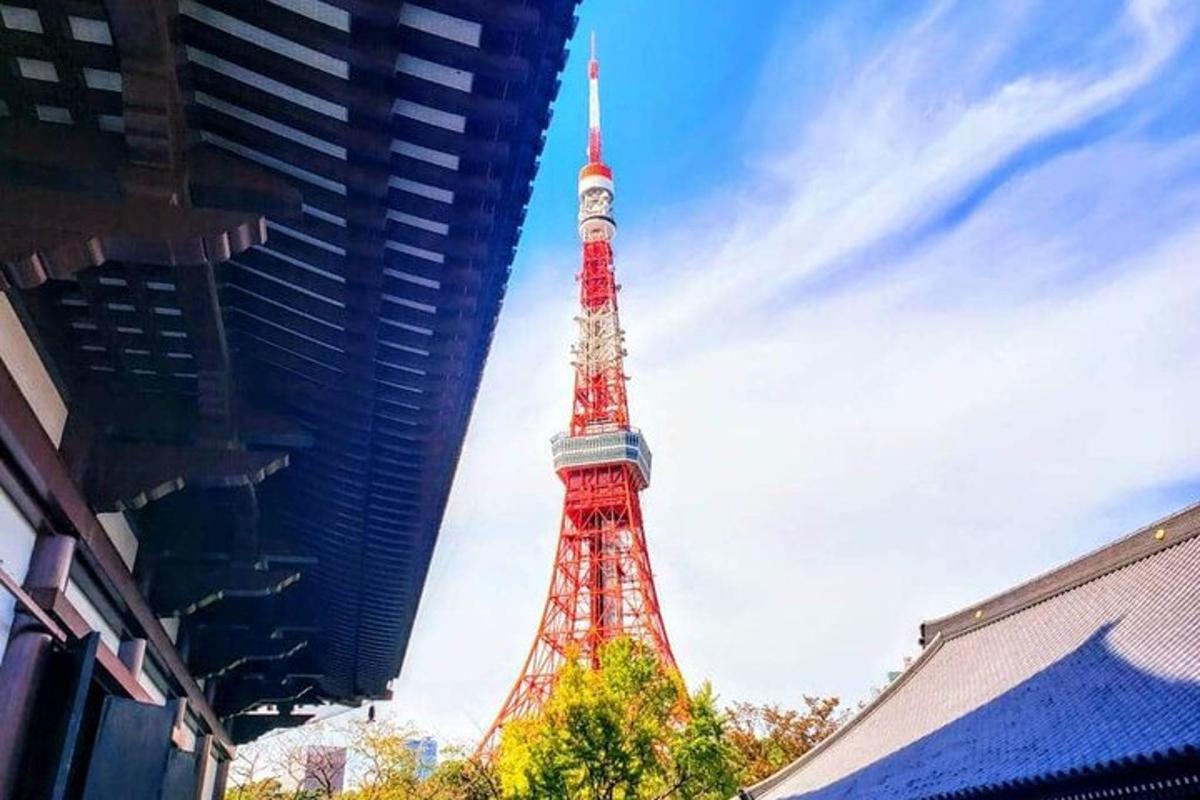 a red and white tower in the middle of a city